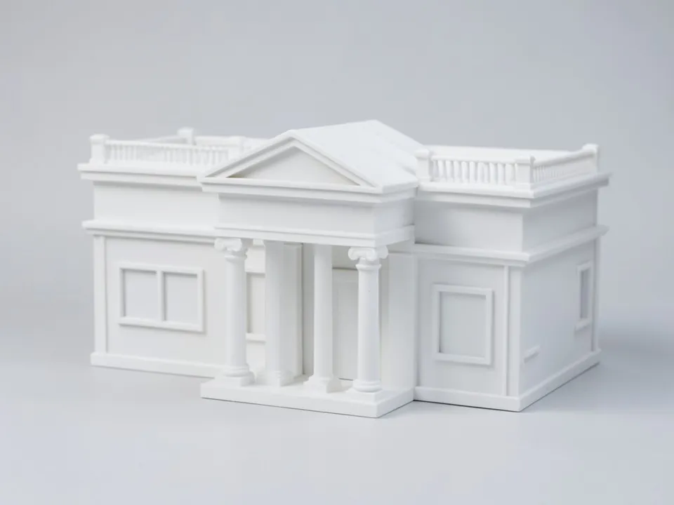 A plain white clay model of a neoclassical villa with one main storey and an attic level, a central portico of four Ionic columns under a pediment, flat roofs with balustrades and side wings